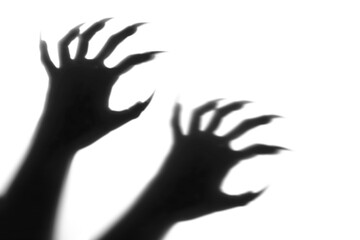Shadow overlay effect for halloween background with Terrifying scary hands with long nails,Creepy monster claw,silhouette of hands,zombie hand rising out of a graveyard