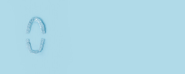 Transparent Dental Clear Aligners on Blue. Invisible Braces. Prevention Gums Treatment. Retainers...