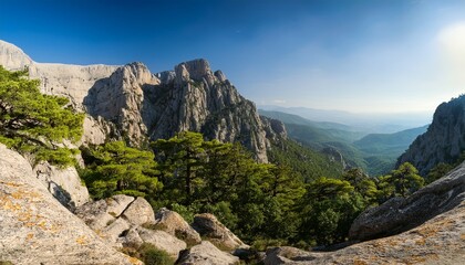 Fototapeta premium olympus surrounded by rocky cliffs and dense green forest vegetation