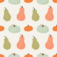 Seamless vector pattern with pumpkins. Fall squash ornament, bright colorful background. Warm cozy colors