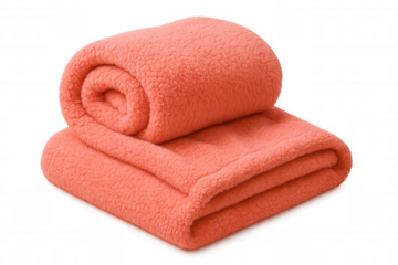Plush coral fleece blanket neatly folding over neutral surface, conveying warmth and comfort