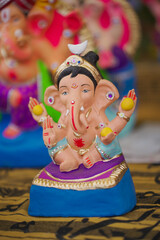 Lord Ganesha idol for Ganesh Chaturthi festival in India, Colorful Ganpati statue Stock Photo, Lord...
