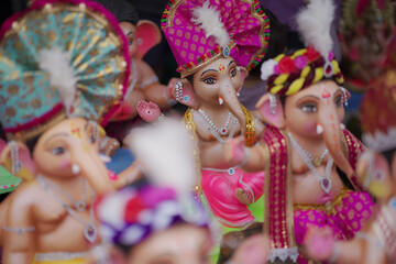 Lord Ganesha idol for Ganesh Chaturthi festival in India, Colorful Ganpati statue Stock Photo, Lord Ganesha murti. 