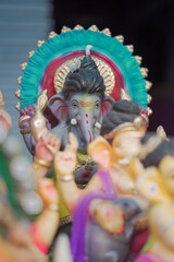 Lord Ganesha idol for Ganesh Chaturthi festival in India, Colorful Ganpati statue Stock Photo, Lord...