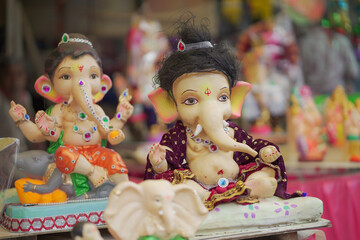 Lord Ganesha idol for Ganesh Chaturthi festival in India, Colorful Ganpati statue Stock Photo, Lord Ganesha murti. 