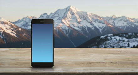 Smartphone with gradient screen against snowy mountain backdrop, winter holiday booking concept