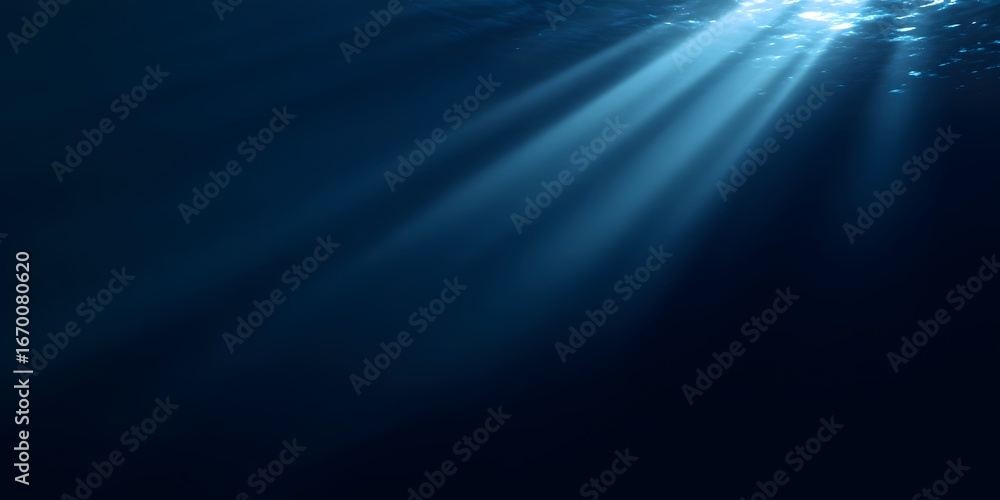 Wall mural a dark blue background with rays of light shining down, creating an underwater effect.