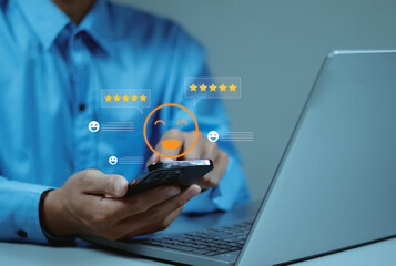 Businessman touching a happy smile face with five-star ratings, representing customer satisfaction,...
