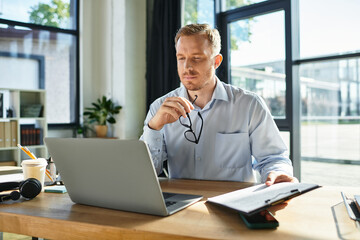 Focused young businessman working diligently in a modern office environment