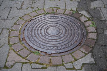 metal sewer lid on the street