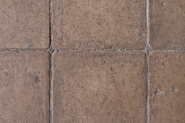 Detailed Macro View of Weathered Outdoor Paving Stones Surface Texture with Visible Grout Lines and Granular Details