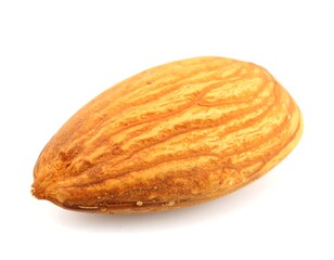 Single almond on white background