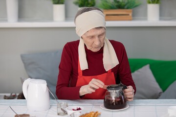 Elderly woman preparing fruit salad at home in the living room