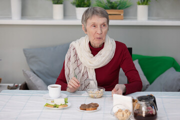 senior woman having breakfast