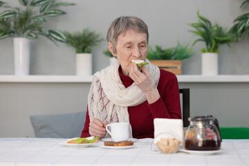 senior woman eating breakfast