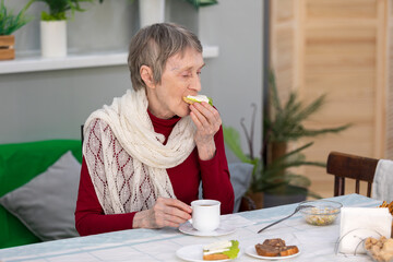 senior woman eating breakfast in a dining room