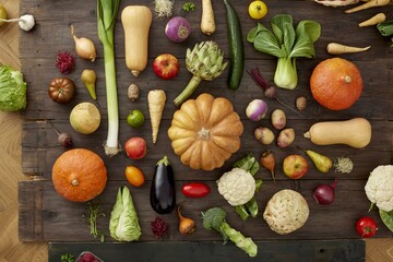 Abundant harvest of fresh vegetables and fruits on rustic wooden table