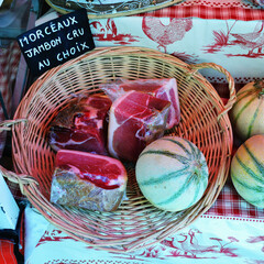 Ham and melon at the rural market. Provence, France