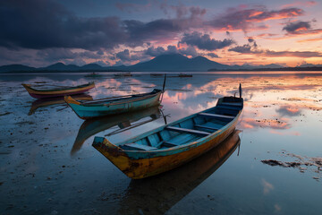 Fototapeta premium estuary with small fishing boats moored, reflection of the evening sun on the water surface
