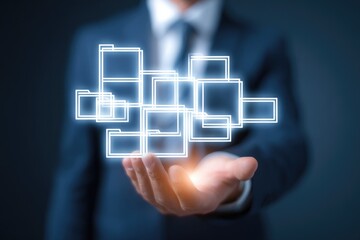 A person in a suit holds a holographic network of folders