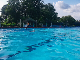 Children learn to swim, diving underwater with fun in the pool to stay fit. Healthy lifestyle