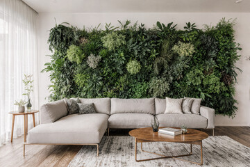 Biophilic Living Room with Vertical Green Wall, Wooden Ceiling, and Large Windows in Daylight