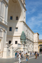 Rome, Italy - August 17, 2019: Bronze sculpture of a Pine cone in front of the Belvedere Palace in...
