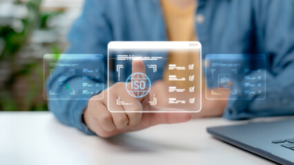 Businessman hand touching virtual ISO certification and quality management system interface....