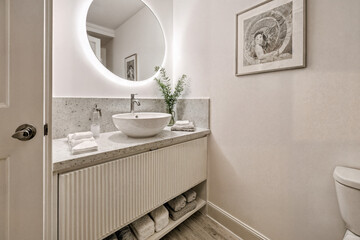 Contemporary Bathroom with Fluted Vanity and Backlit Mirror