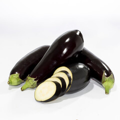 Fresh eggplants display with sliced aubergine isolated on white background
