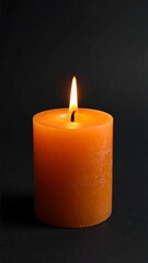 Single orange candle on black background