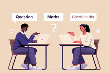 Two students discussing questions and marks while working on laptops at desks