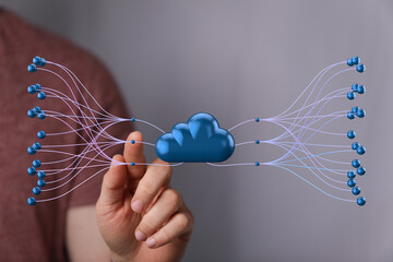 Hand interacting with 3D cloud network, showcasing data connections and cloud storage solutions.
