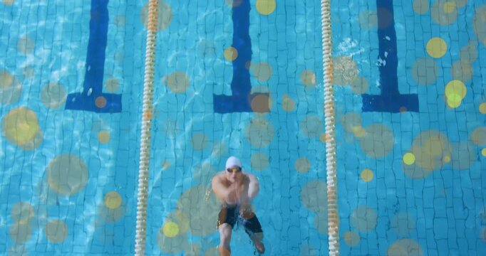 Male swimmer crouching on block then diving at animated start cue and racing backstroke