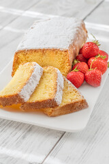 Pound Cake Slices with Whipped Cream and Strawberries on Elegant White Plate