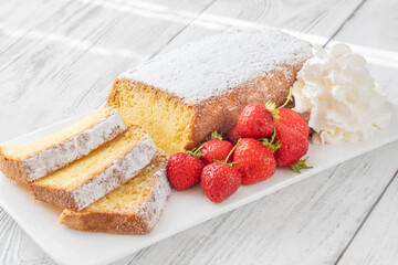 Pound Cake Slices with Whipped Cream and Strawberries on Elegant White Plate