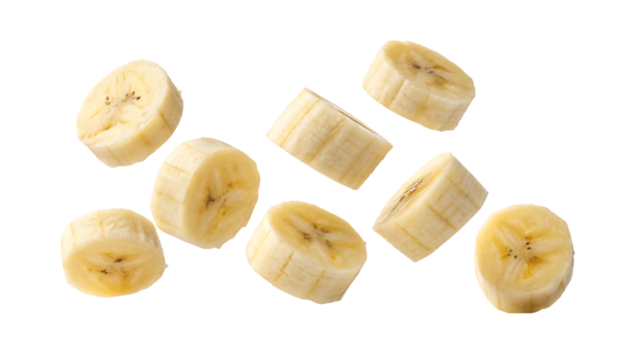 flying delicious banana slices cut out isolated on white background