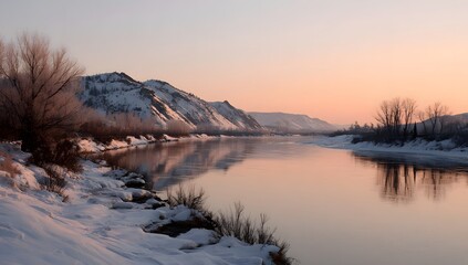 Beautiful winter sunrise over a serene river with snow covered banks and trees reflecting the golden sky