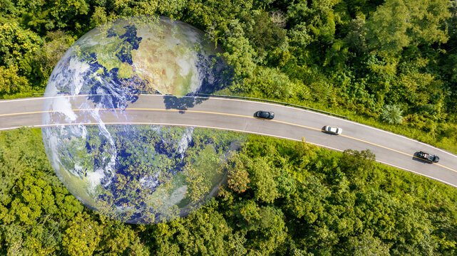 Aerial top view road in forest with car motion blur. Winding road through the forest. Car drive on the road between green forest. Ecosystem ecology healthy environment road trip.