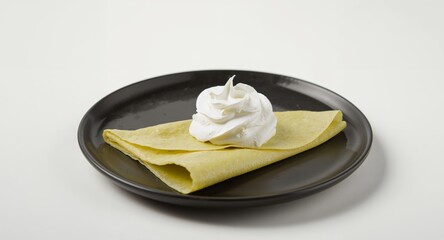 Crepe Creation. A Delicate Composition of Texture and Contrast on a Dark Plate.