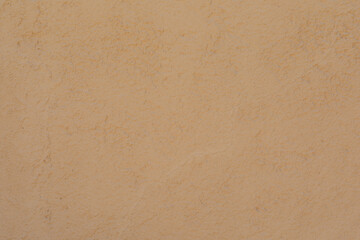 High-resolution image of a beige wall texture. Perfect for backgrounds, websites, and design projects.