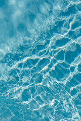High-quality photo of blue water surface with ripples and reflections. Perfect for backgrounds and textures.