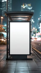 Empty advertisement on bus stop at night