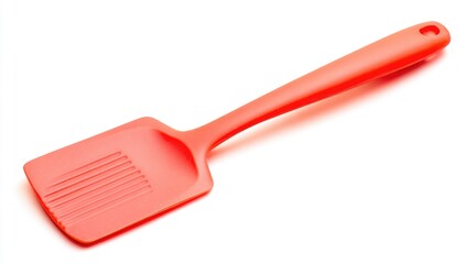 Coral-colored spatula, angled view