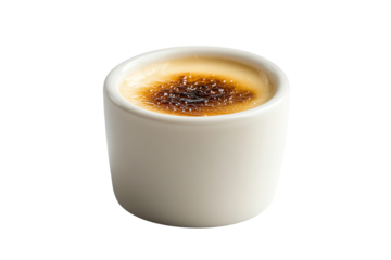 Delicious creme brulee in a white ceramic ramekin, showcasing a crispy caramelized top and creamy custard underneath.