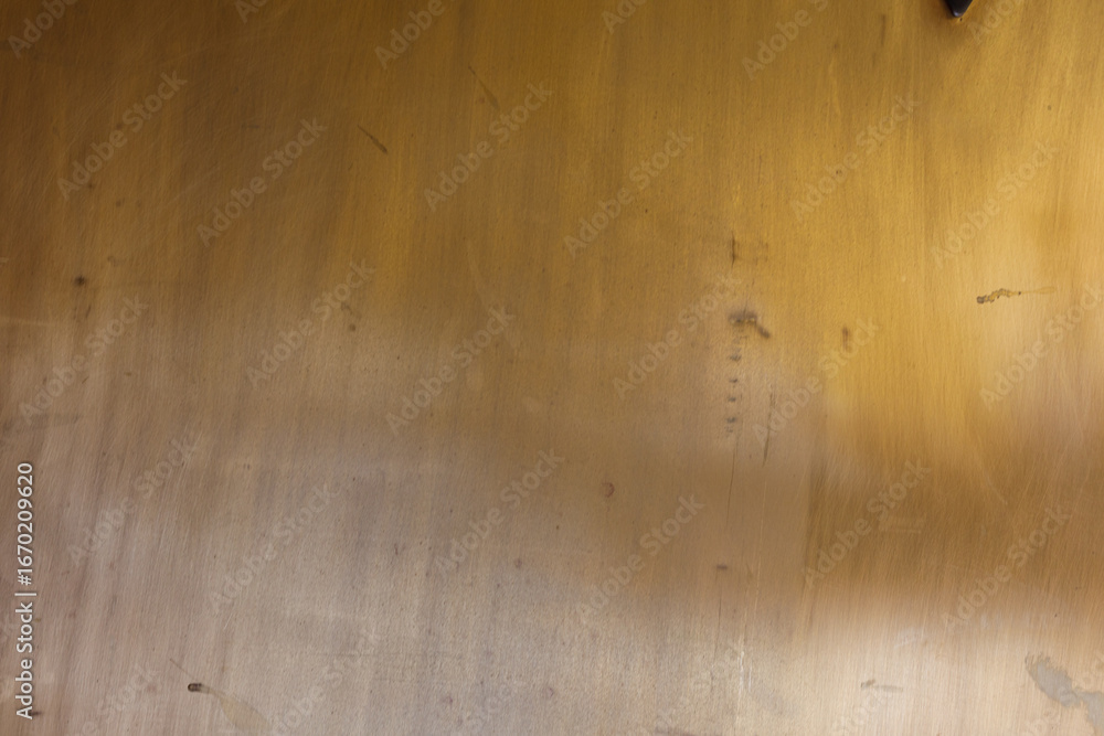 Poster High-resolution image of a golden brown textured wall, perfect for backgrounds and design projects. Subtle variations in tone and texture add v