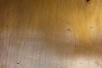 High-resolution image of a golden brown textured wall, perfect for backgrounds and design projects. Subtle variations in tone and texture add v