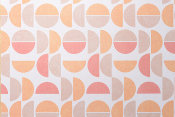 gradient effect on scrapbook paper with a series of semi or half circles in pastel tan orange and...