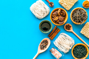 Rice vermicelli, noodles, spices, weeds pattern to cook Chinese and Japanese food on blue...