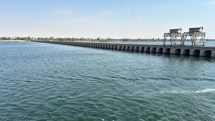Esna, Egypt - Feb 9, 2025: View of the Esna Lock on the Nile River, a major waterway structure near Luxor used for navigation of cruise ships and vessels.